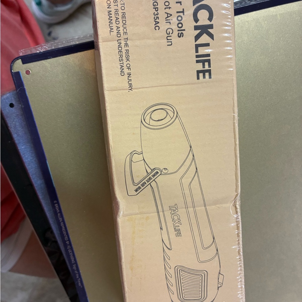 TACKLIFE Heat Gun in Tan Packaging